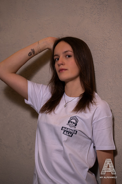 white T-shirt with Hannes Alm logo on the left front