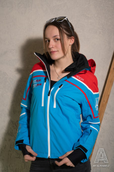 Blue red ski jacket: Susi Alm & Hannes Alm logo on the front right, Alpenwelt logo on the left sleeve